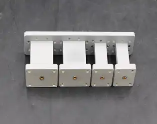 What are the key features and benefits of an End Launch Waveguide to Coaxial Adapter?